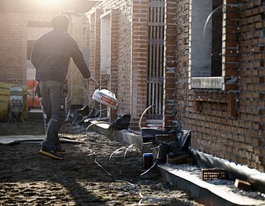 Installer dropping low voltage cable coil on the ground